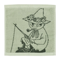 Towel 25x25cm Snufkin green - Enjoy the soft coziness of a small green Moomin towel made out of organic cotton, featuring the harmonica-playing wayfarer ... The product is Global Organic Textile Standard (GOTS) certified.