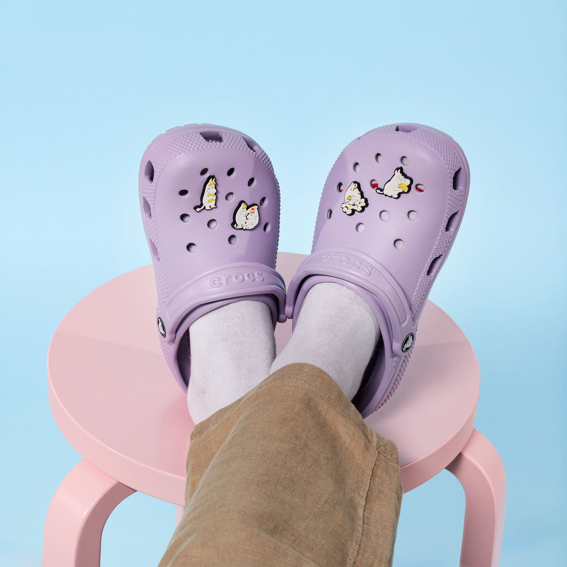 Moomin 3D charm Sweethearts v3 - Purple Crocs with Moomin charms on a light blue background