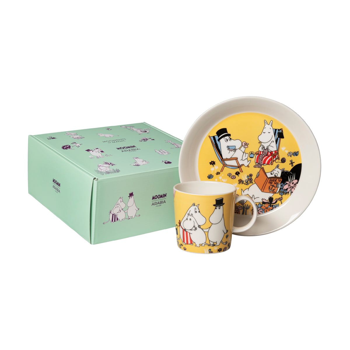 Moomin set mug & plate Family Time - A Moomin-themed ceramic mug and matching plate set with a mint green gift box. The mug and plate featuring the Family Time illustration