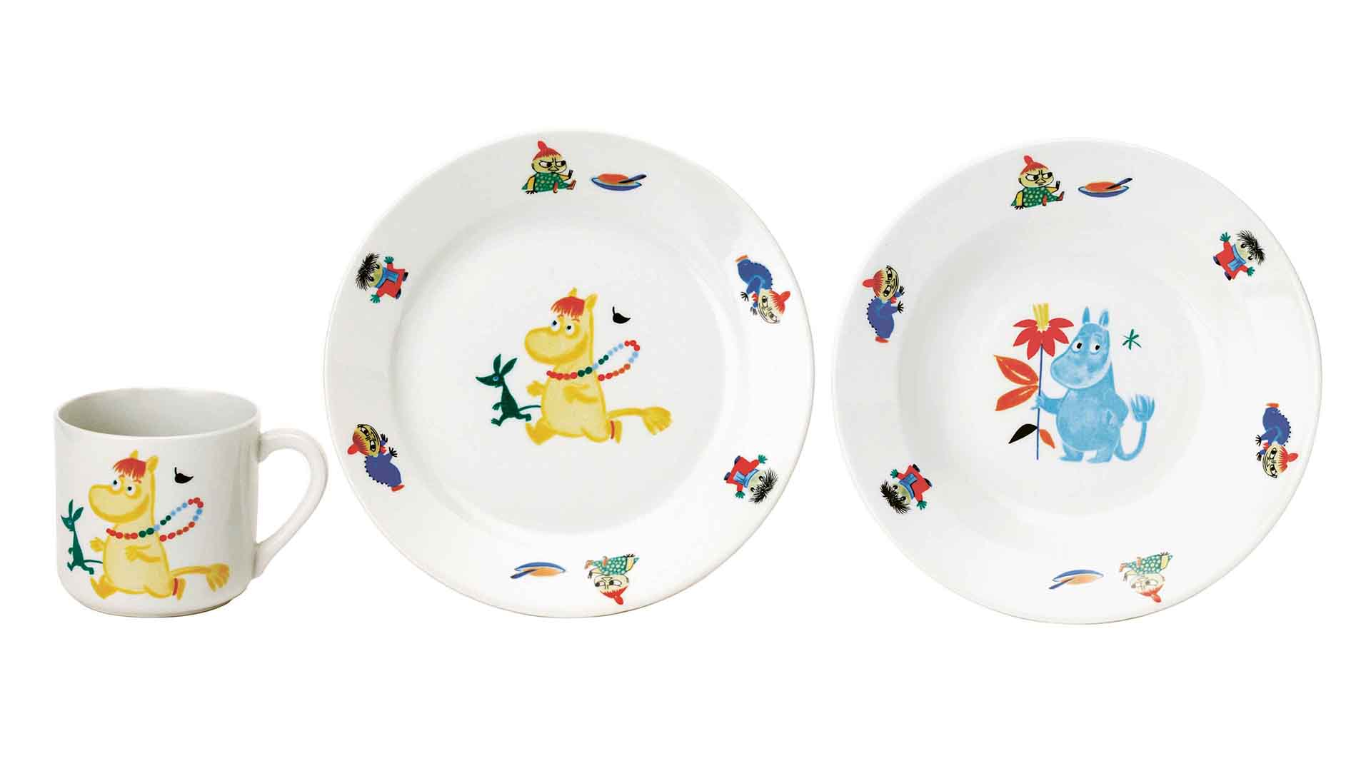 Children's ceramic tableware set with Moomin characters on a white background