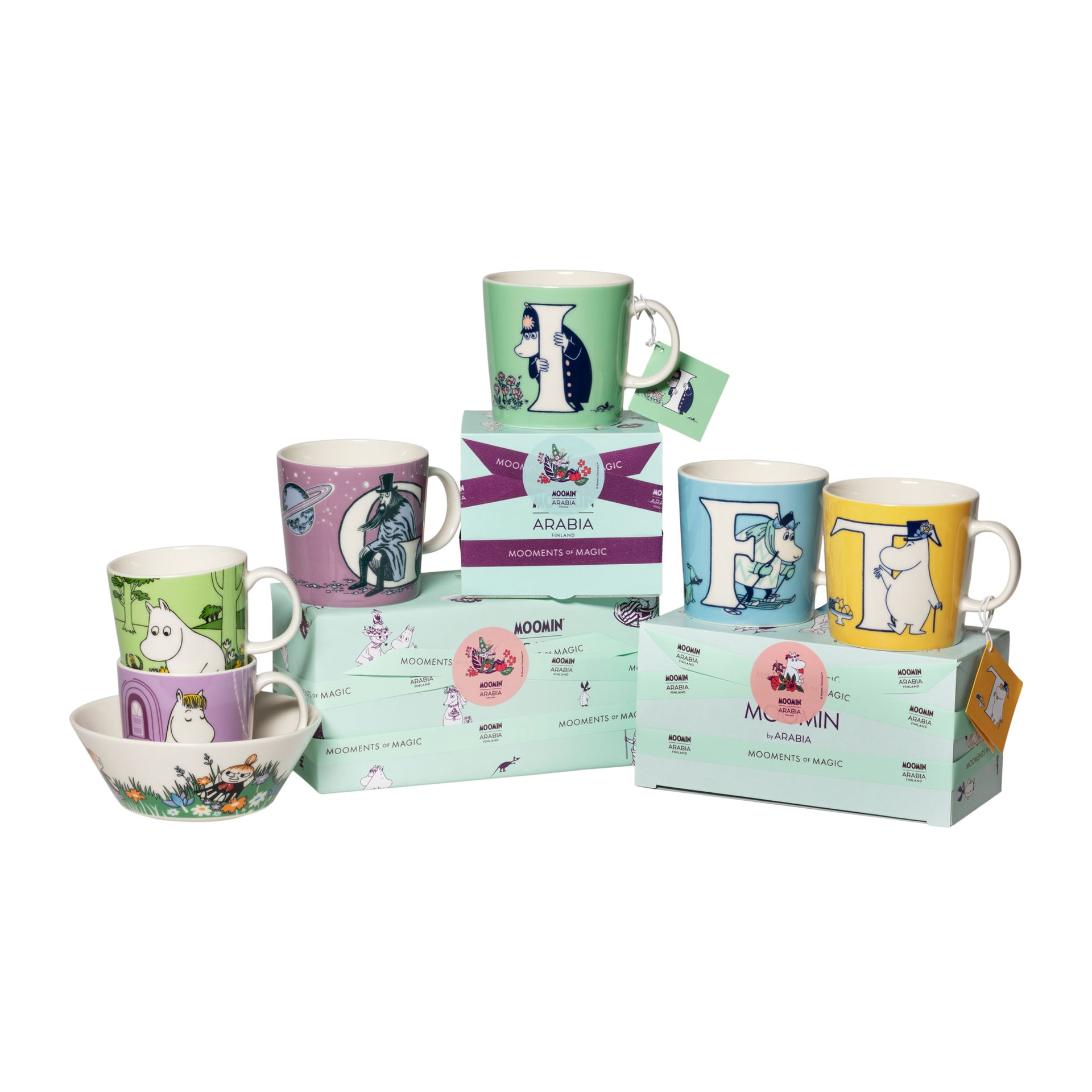 Collection of Moomin mugs and gift-wrapped boxes on a white background