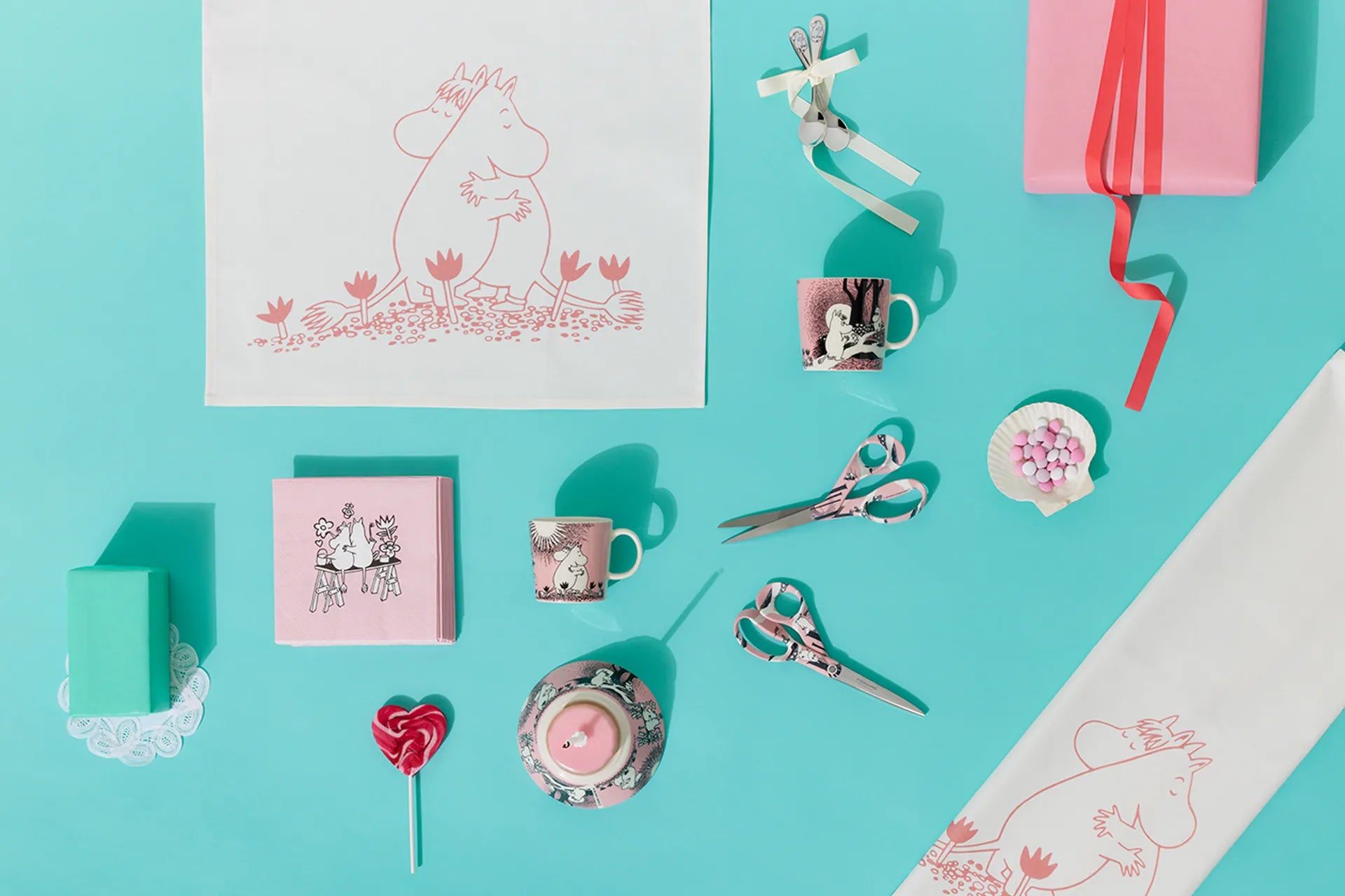 Collection of stationery Moomin Love items on a turquoise background